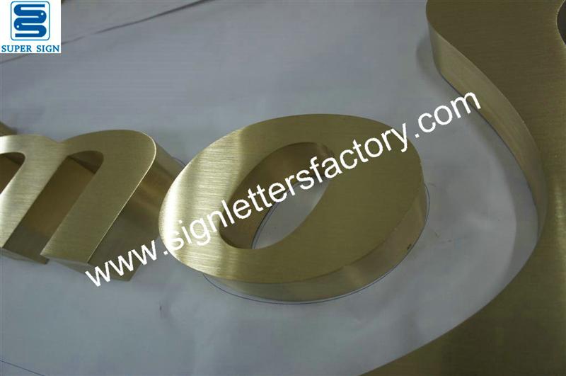 fabricated brushed brass sign lettering